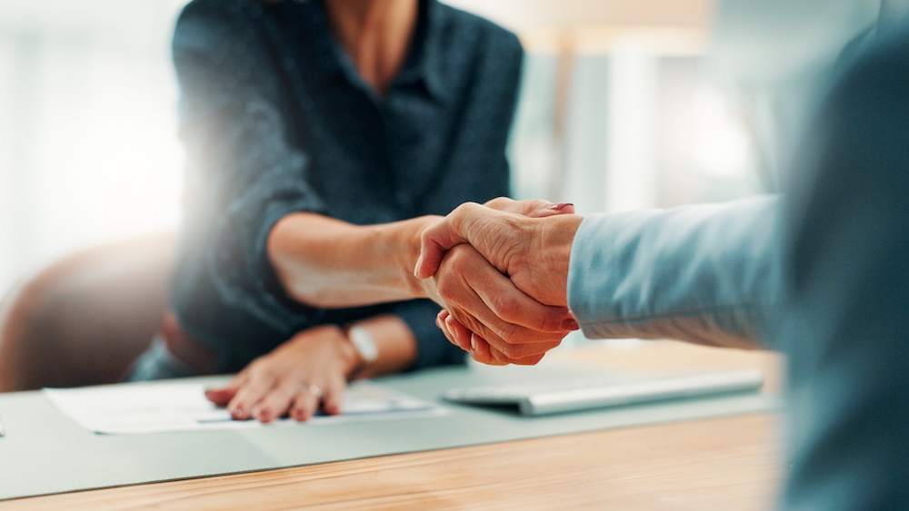 two people shaking hands