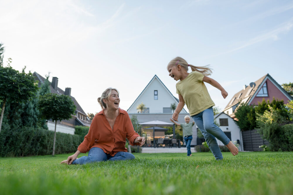 happy family playing at front yard